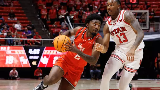 Jacobe Coleman drives the lane against Utah