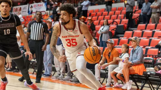 Po'Boigh King dribbles against Schreiner at Johnson Coliseum