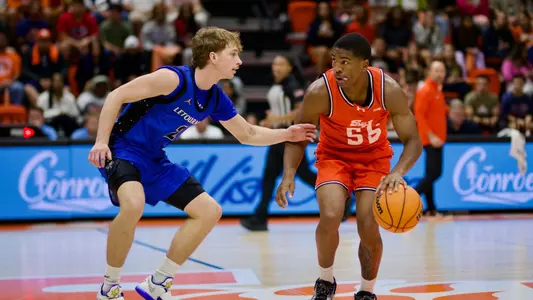 Jacob Walker dribbles against LeTourneau