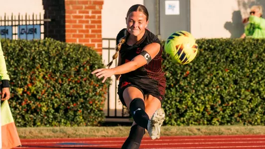 Kaitlyn Vance kicks a corner during the semifinals against Liberty
