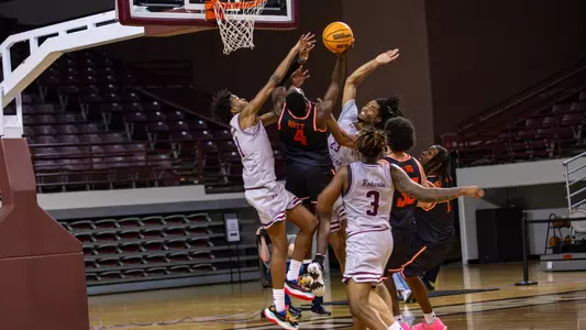 Kashie Natt fights his way to the basket against Texas Southern