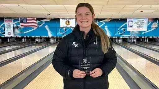 Katie Paris with her all-tournament team trophy at the Lewis Flyer Classic