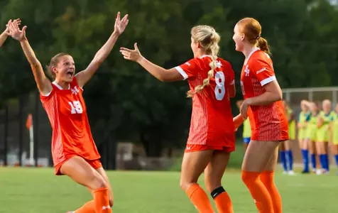 Hannah Bolin (18) and Kinsey Hill (8) celebrate Hill's goal against Texas A&M-CC