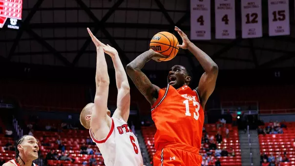 Isaiah Manning goes up for a shot against Utah