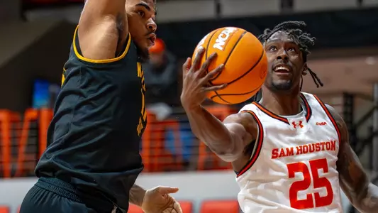 Damon Nicholas Jr. goes up for a layup against Kennesaw State