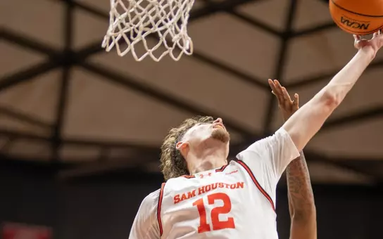 Matt Dann rebounds a missed shot against Biblical Studies