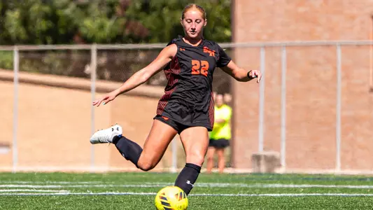 Lia Millward follows through with a free kick against NM State
