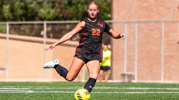 Lia Millward follows through with a free kick against NM State