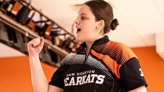 Emily Hart celebrates after a roll at the Kat Klub