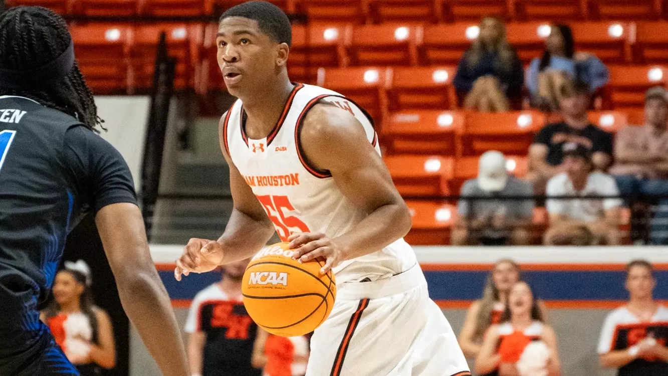 Jacob Walker dribbles against Middle Tennessee