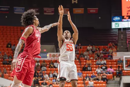 Jacob Walker shoots over a Jax State defender