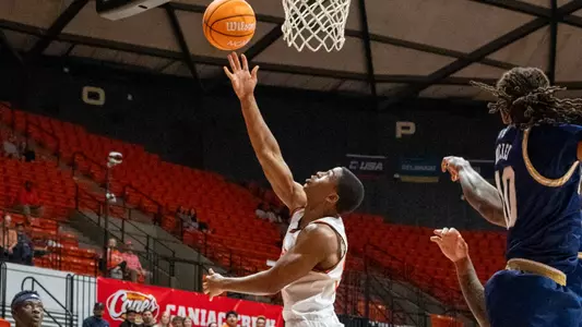 Jacob Walker lays a shot up against FIU