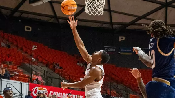 Jacob Walker lays a shot up against FIU