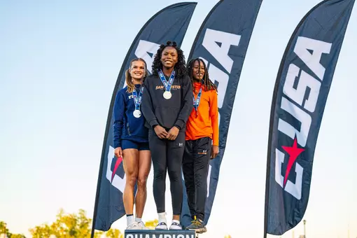 Nia Thompson, center, won the long jump at the CUSA Outdoor Championships