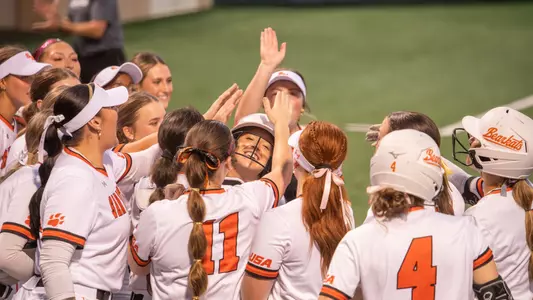 The Sam Houston softball team celebrates against HCU
