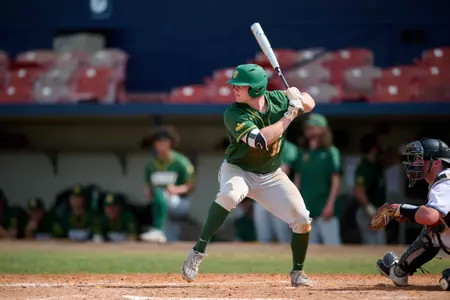North Dakota State Bison first baseman Brock Anderson (11) bats during an NCAA baseball game against the Maine Black Bears on March 11, 2022 at Chain of Lakes Stadium in Winter Haven, Florida. (Mike Janes/Four Seam Images)