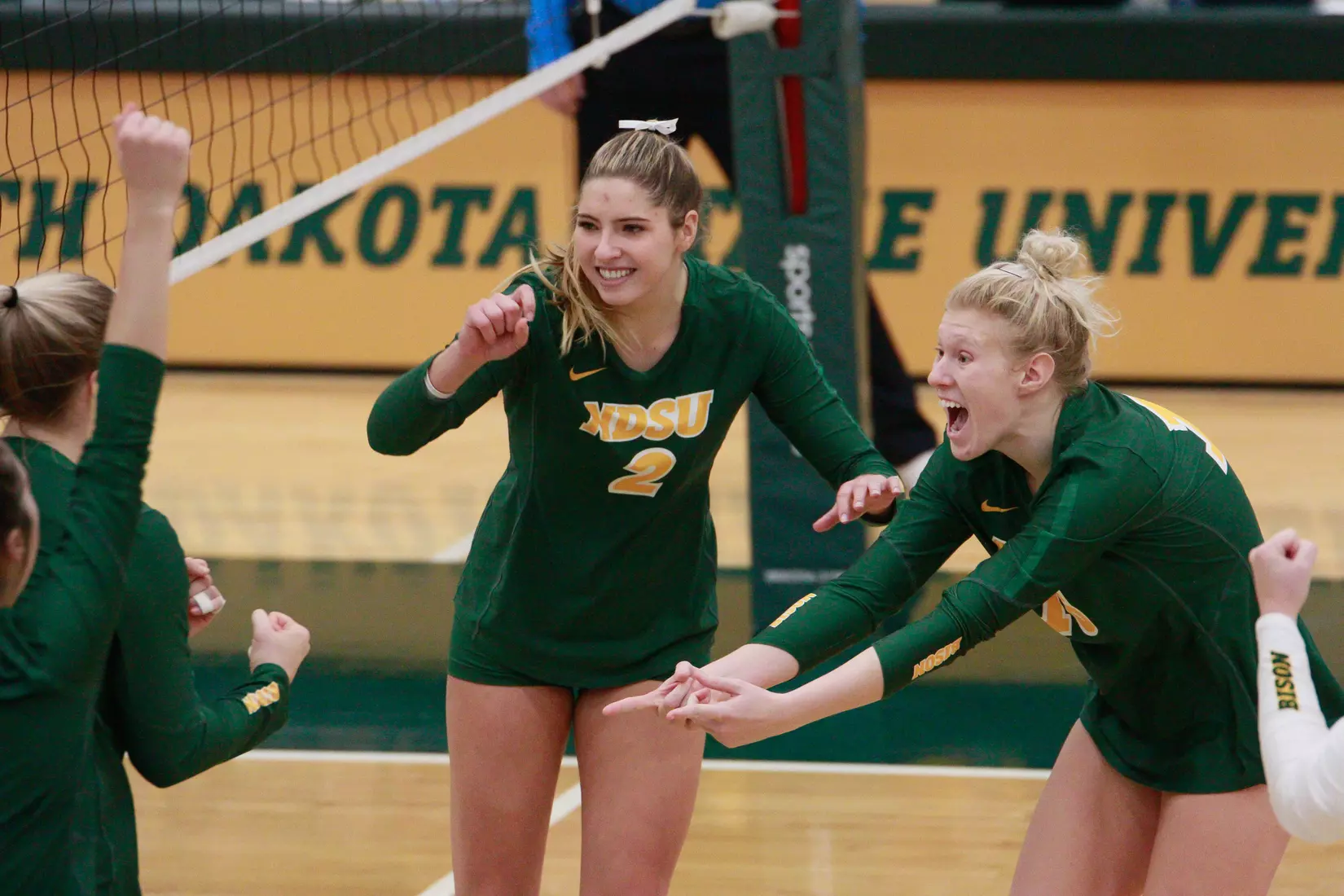 North Dakota State's Bella Lien, Allie Mauch and Kalli Hegerle against Denver in the Bentson Bunker Fieldhouse.