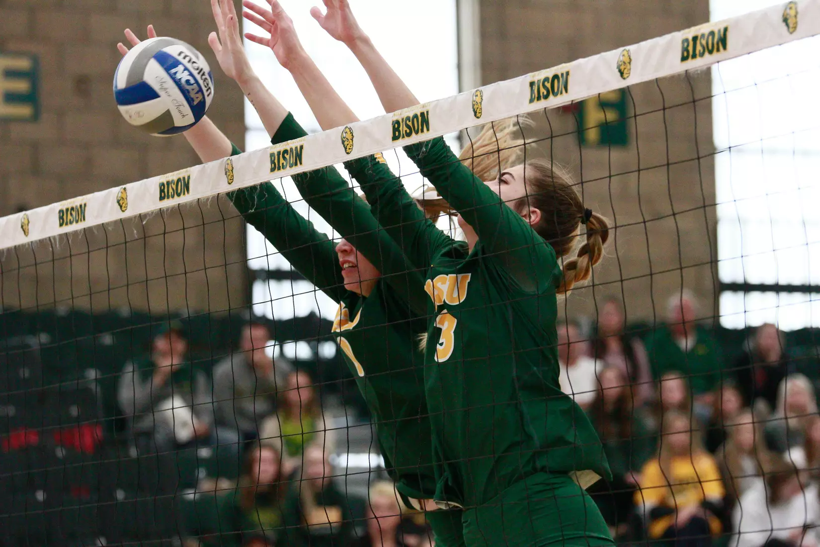 North Dakota State's Emily Halverson and Syra Tanchin against Denver in the Bentson Bunker Fieldhouse.