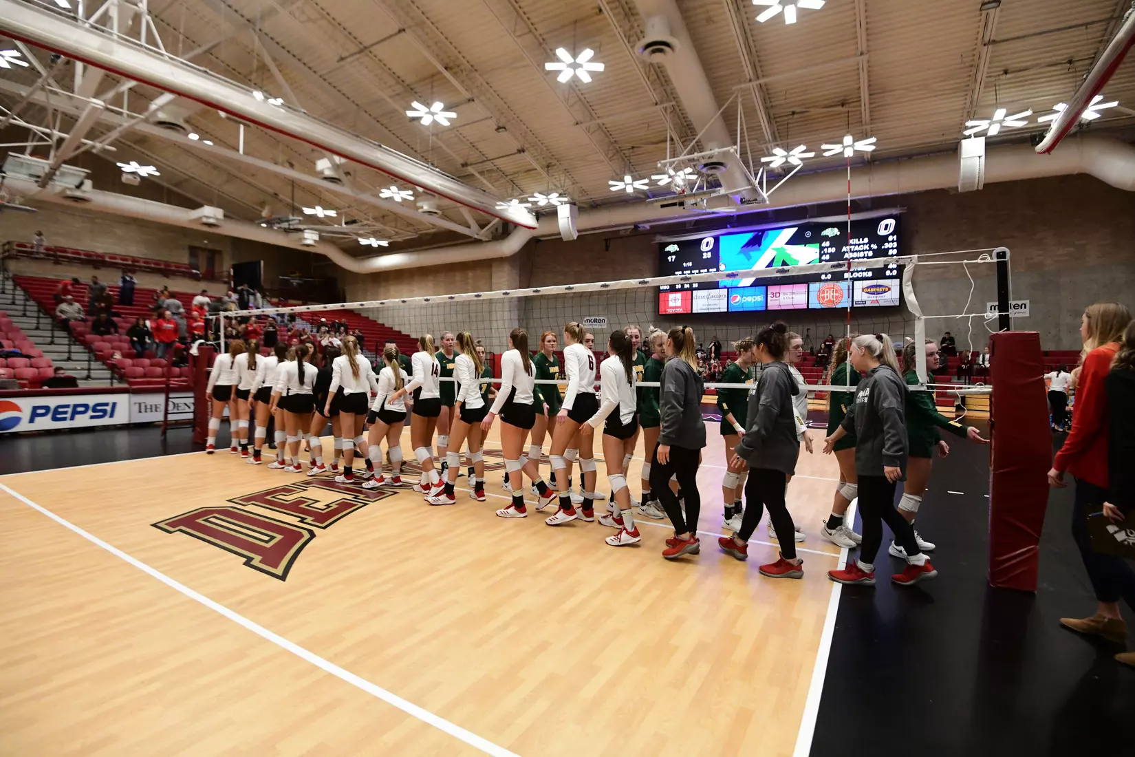 North Dakota State and Omaha shake hands following the Summit League tournament quarterfinal against Omaha on Nov. 22 in Denver.