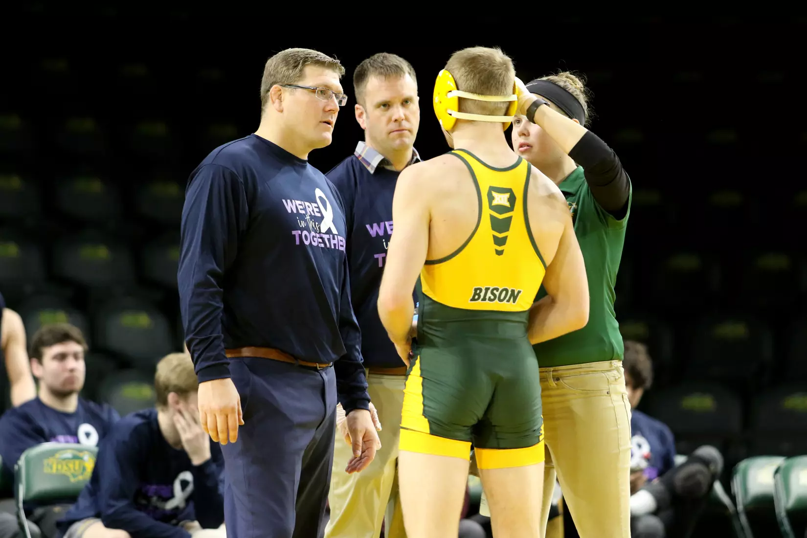 North Dakota State head coach Roger Kish, Mike Kjellerson, 149 Jaden Van Maanen during the 32-9 win over Augustana on Dec. 1 in Scheels Center.