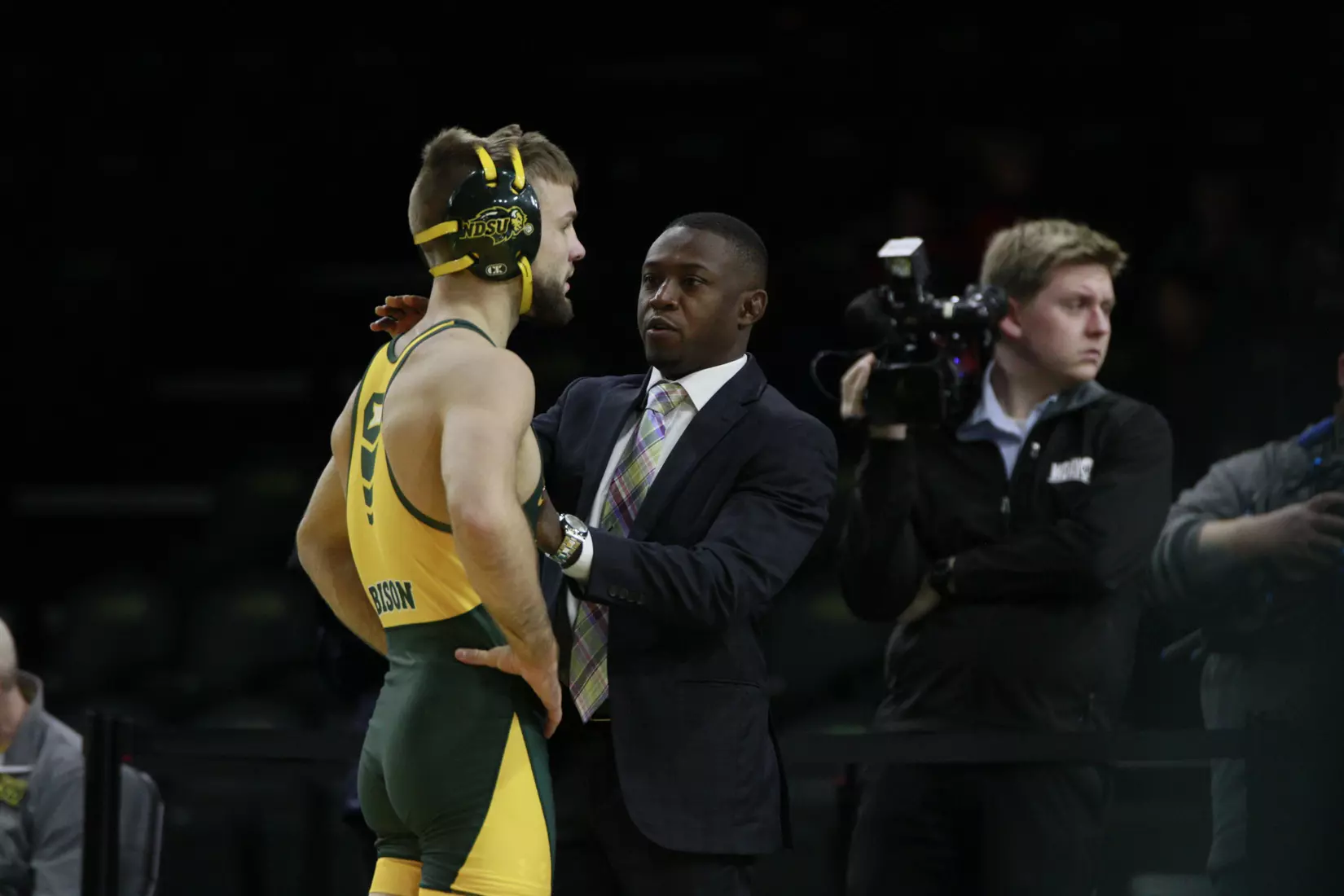 North Dakota State 133 Cam Sykora and head assistant Obenson Blanc during Bison 24-9 win over Cal State Bakersfield on Nov. 3 in Scheels Center.