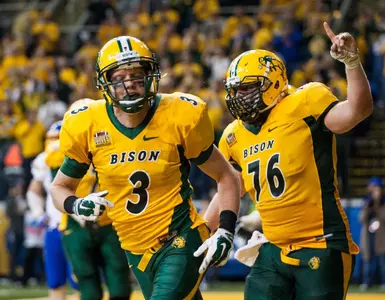 Trevor Gebhart (3) and Jesse Hinz (76) celebrate a TD