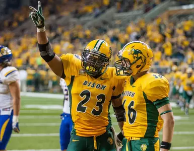 John Crockett (23) and RJ Urzendowski (16) celebrate a TD