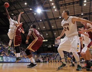 TrayVonn Wright shoots as Taylor Braun (24) gets position.