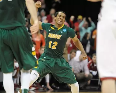 Lawrence Alexander pumps his fist in excitement.