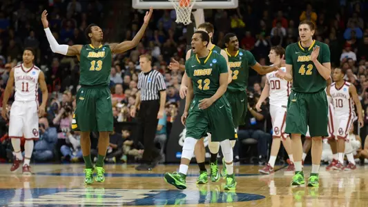 Carlin Dupree, Lawrence Alexander and Marshall Bjorklund celebrate in the final seconds.