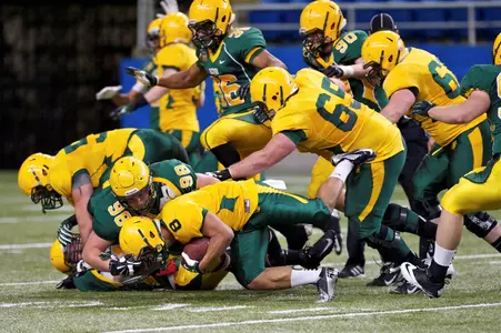 Austin Farnlof (98) tackles Darius Anderson (8)