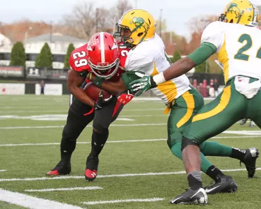 CJ Smith (6) wraps up as Bryan Shepherd (24) closes in.