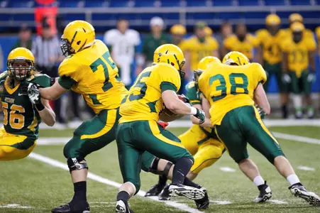 Dan Sargeant (38) blocks for Chase Morlock (25)
