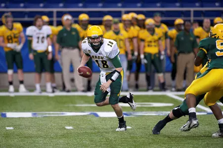 Cole Davis scrambles from pressure