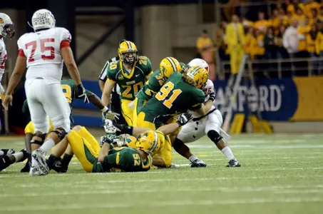 Mike Hardie (91) and Jordan Champion (32) make a tackle.