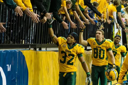 Jordan Champion (32), Nate Moody and Zach Colvin greet fans.