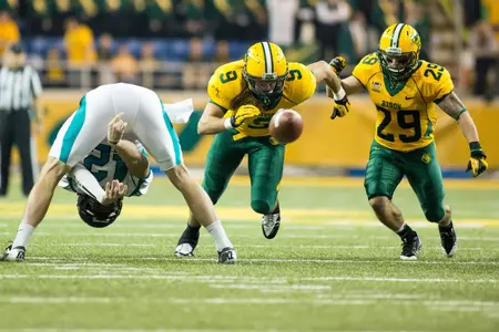 Esley Thorton (9) and AJ Van Voorhis (29) on the punt rush.
