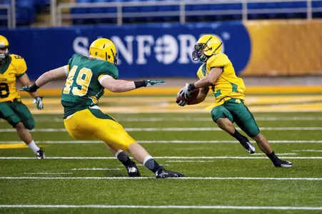 Nick DeLuca (49) reacts to the move by Tyler Wrice (2)