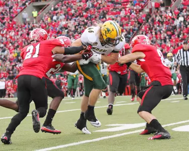 Andrew Bonnet drags tacklers after catching a pass.