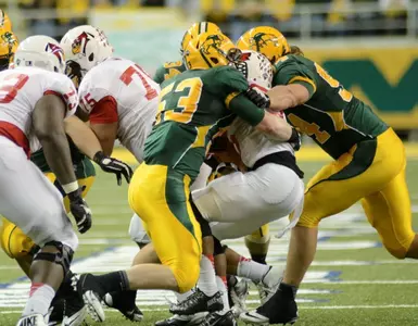 Kyle Emanuel (53) and Danny Luecke (94) make the tackle.