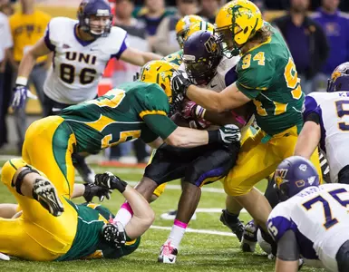 Kyle Emanuel (53) and Danny Luecke (94) make the tackle.