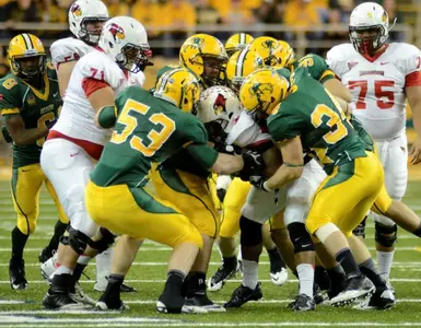Kyle Emanuel (53) and Grant Olson try to strip the ball.