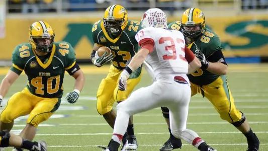 Andrew Grothmann (40) and Zack Johnson (66) block.