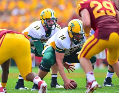 Jesse Hinz (76) snaps to Carson Wentz (11)