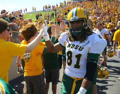 Isaiah Frandsen (81) celebrates with fans