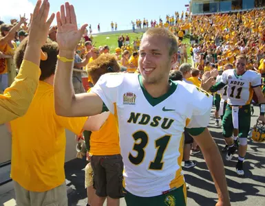Tom Barneson (31) celebrates with fans