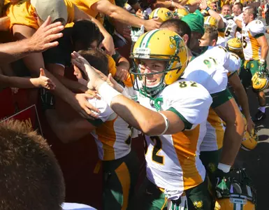 Zach Vraa (82) celebrates with fans