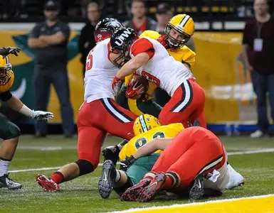 Austin Farnlof (98) and James Gates (58) defense