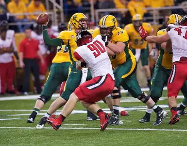 Jack Plankers (70) blocks for Carson Wentz (11)