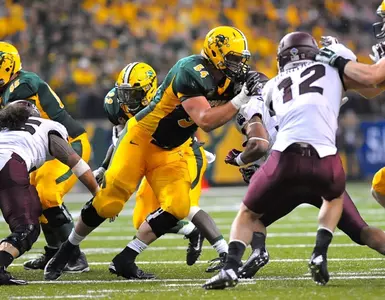 Jeremy Kelly (54) blocks for King Frazier (22)